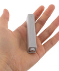 Push To Open Cabinet Latch Set 4 Pack for Closets, Drawers, and Doors shown in hand for size reference