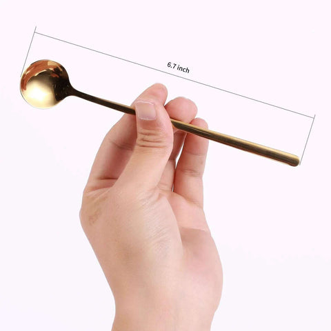 Hand holding Gold Tone 6.7 Inch Long Handle Coffee And Tea Spoon, stainless steel, mirror finish, kitchen essentials.