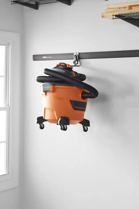 FastTrack Ladder Hook Wall Mount System For Garage Shed And Home holding vacuum cleaner.