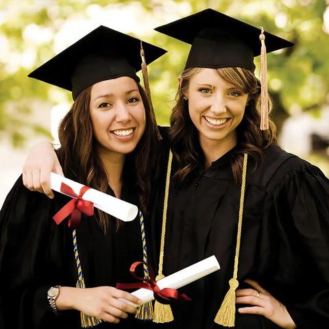 Two graduates in gowns wearing Royal Blue And White Graduation Cords For 2026 Honor Cord Braided 67 Inch Long Graduation Ropes