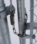 Close-up of Heavy Duty 1 3/8 Inch Chain Link Fence Gate Post Hinge Set Built Tough Galvanized Carbon Steel 4 Pack For 32mm Pipe Panels Male And Female Hinges Max Load 220 Lb Fits 1 3/8 Inch Posts Easy Install showing chain and hinge installed