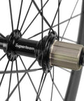 Close-up of Superteam hub on 50mm And 23mm Carbon Road Wheelset 700c Clincher Front And Rear For Shimano 8 9 10 11 Speed
