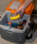Heavy Duty Work Cooler And Lunch Box That Keeps Cold Up To 30 Hours, 17 Quart Capacity For 18 Cans, Holds 300 Pounds And Doubles As A Sturdy Seat, Rugged Tradesman Pro Tough Box With Full Size Lid, opened with bananas and drinks inside