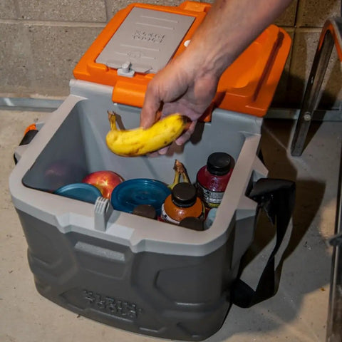 Heavy Duty Work Cooler And Lunch Box That Keeps Cold Up To 30 Hours, 17 Quart Capacity For 18 Cans, Holds 300 Pounds And Doubles As A Sturdy Seat, Rugged Tradesman Pro Tough Box With Full Size Lid, opened with bananas and drinks inside