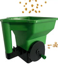 Green handheld lawn spreader with precise control and anti clog hopper for even seed and fertilizer distribution on lawns.