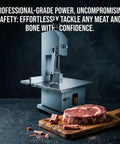 Heavy Duty Commercial Electric Bone Saw With Stainless Steel Table And Eight Replacement Blades 2500W Meat Bandsaw on a countertop.