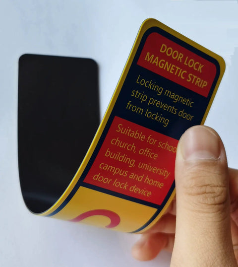 Person holding a Six Pack Magnetic Lockdown Strip for Iron Door Frames with High Density Magnets and durable yellow PVC surface, reusable.