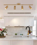 4 Light Gold Finish Flush Mount Ceiling Fixture With Rotating Heads in modern kitchen setting.