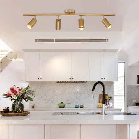 4 Light Gold Finish Flush Mount Ceiling Fixture With Rotating Heads in modern kitchen setting.