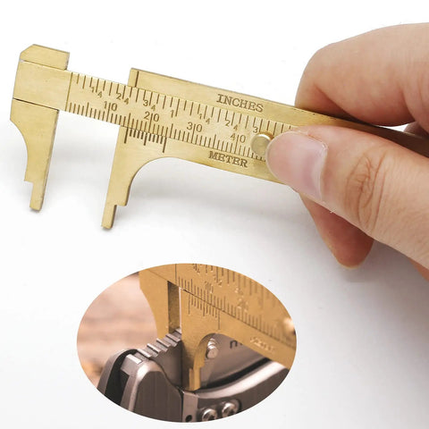 Close-up of Brass Pocket Vernier Caliper Ruler, Handy Sliding Gauge, Mini Vernier Caliper With Dual MM and Inch Scales in use.