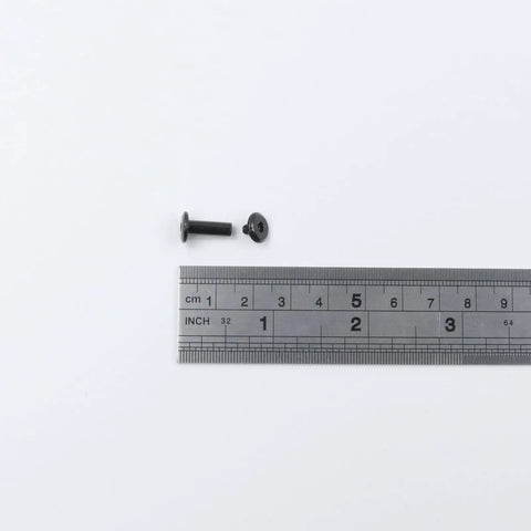 20 Sets M3x12mm Black Furniture Bolts And Nuts Kit with ruler for size reference.