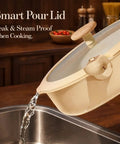 Smart pour lid in use, part of the Detachable Handle Ceramic Cookware Set, 18-Piece Nonstick Pots and Pans for RV and Camping.