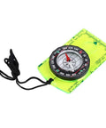 Trail-Ready All-In-One Orienteering Compass for hiking, camping, backpacking on a green acrylic plate with black lanyard