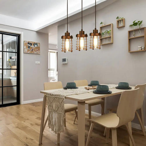 Three Pack Rustic Pendant Lights With Mini Metal Cage Shades In Bronze Finish Industrial Vibe Edison Style Hanging Fixtures For Kitchen Island Bar Foyer With Easy Hardwire Install in dining room setting