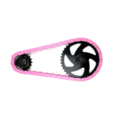 Image of a bike chain wrapped in Pink Solid Toddler Bicycle Chain Cover Snap On No Tools Required Protects Clothing From Chain Lube