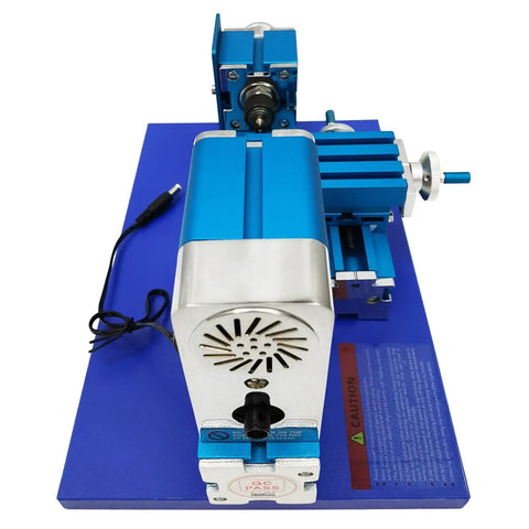 IntXanth All-Metal Mini Wood Lathe Machine Spinning At 20000Rpm For Precision Hobbyist Carving Turn Soft Metals And Plexiglass Crafts With Ac100-240V Power Durable Build on blue base.