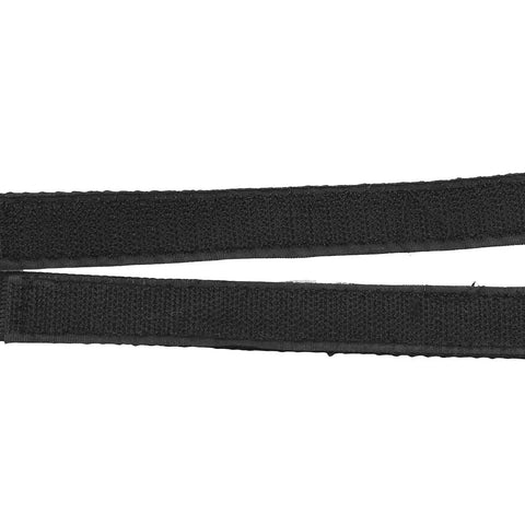 Close-up of black nylon bicycle foot straps with double-sided adhesive backing for fixed gear pedals, durable non-slip.