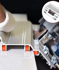 Heavy Hitter Tile Chamfering Machine With 45 Degree Ceramic Bevel Cutting Seat, Darn Tough Alloy Mount Bracket For Pneumatic Electric Stone Grinders, Reliable Outside Corner Trim Guide close-up with hand using the alloy guide on tile edge.