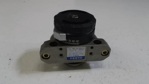 Buttery Smooth Rotary Vane Pneumatic Actuator With Double Acting Swivel Motion and Elastic Cushioning Ends top view showing control knob and metal body.