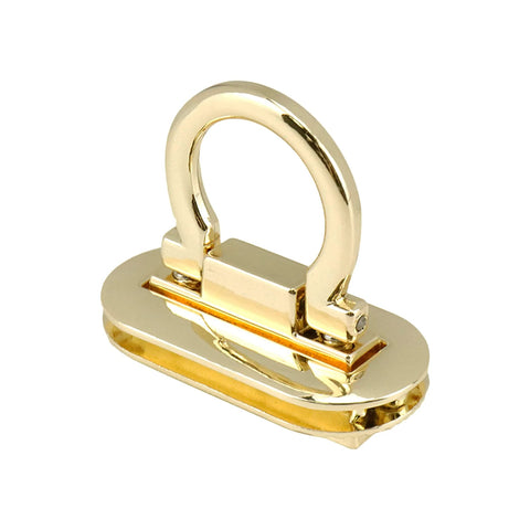 Close-up of gold ring-style turn lock clasp for handbags and purses