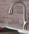 Merlin Dual Function Pull-Down Kitchen Faucet With Single Handle, 16-Inch Reach, Spot-Free Stainless Steel on kitchen counter