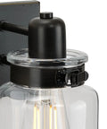 Close-up of Vintage Farmhouse Bath Vanity Light With Clear Glass Shades, 4 Light Antique Bronze Finish, bulb detail