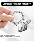 Radiator bleed keys on a keyring; three chrome metal keys held by a hand.