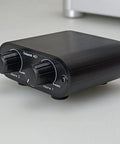 Two Channel 3.5mm Stereo Mini Headphone Mixer With Dual Inputs And 3.5mm Aux Output, front view showing volume knobs.