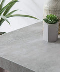 Concrete Grey Self-Adhesive Film Roll For Walls, Cabinets, And Furniture, Large 26x78 Inch, 4-Pack, Easy Peel And Stick Decor For DIY Home Makeovers Today on tabletop with plants and vases.