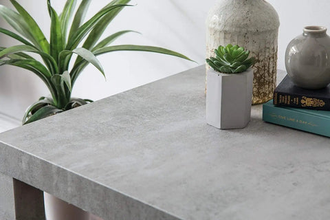 Concrete Grey Self-Adhesive Film Roll For Walls, Cabinets, And Furniture, Large 26x78 Inch, 4-Pack, Easy Peel And Stick Decor For DIY Home Makeovers Today on tabletop with plants and vases.