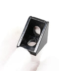 Close-up of a black heavy-duty Ten Pack 20mm Aluminum T Slot Corner Bracket for 90 Degree Joins with M5 Bolts and Nuts.