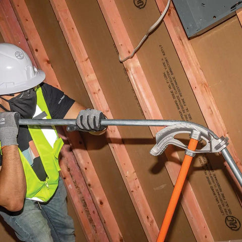 Worker using Aluminum Conduit Bender Full Assembly For 1/2-Inch EMT With Wide Foot Pedal and Angle Setter for accurate bends