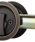 Round Privacy Pocket Door Latch With Aged Oil Rubbed Bronze Finish Easy Install Sliding Door Handle For Bathroom Or Bedroom 2 3 Eighths Backset Universal Fit Locking Passage Pull close-up
