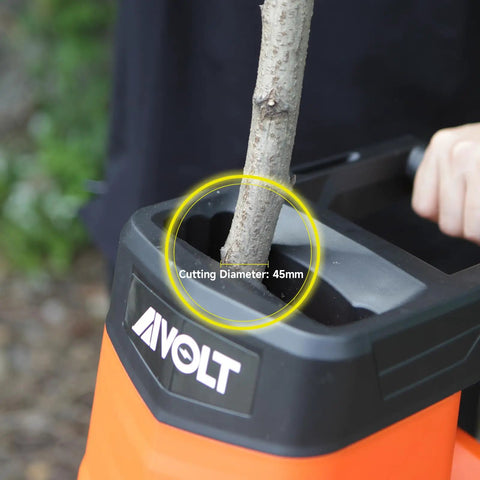 Beast 1800W Electric Wood Chipper Shredder cutting a branch, yard cleanup tool with 21 to 1 reduction and 50-liter bag