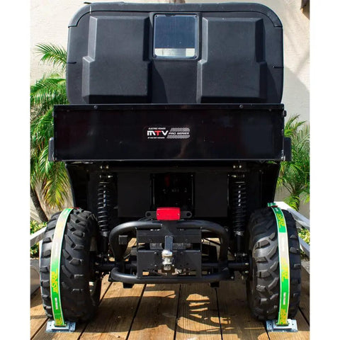 Rear view of an ATV securely tied to a trailer using Fastrap Tie Down Kit For Trailers Secure ATVs ZTRs And 4 Wheelers