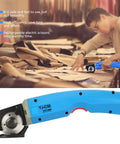 Person using Cordless Electric Scissors Rotary Cutter 3 Point 6V Rechargeable 4500 RPM 35W for fabric cutting on table.