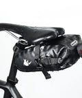 Waterproof Under Seat Saddle Bag For Bike With 1.5L Capacity, rainproof MTB and road bike seat bag, mounted on bike with raindrops