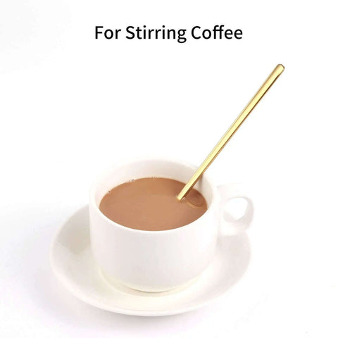 Gold Tone 6.7 Inch Long Handle Coffee And Tea Spoon in white cup with coffee, showing stirring use, stainless steel, mirror finish