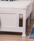 Twin Size Solid Wood Platform Bed Frame With Headboard No Box Spring Needed White Finish showing sturdy corner with slats.