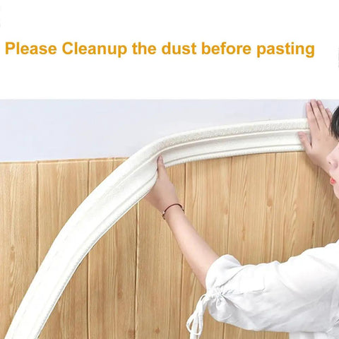 Person applying Self Adhesive Flexible Foam Molding Trim 90 Inch Long By 3 Inch Wide 3D Decorative Wall Border on wood wall