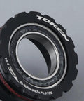 Close-up of Token T47 Threaded Bottom Bracket Black For Shimano 24mm Steel Bearing showing alloy build and bearing detail.