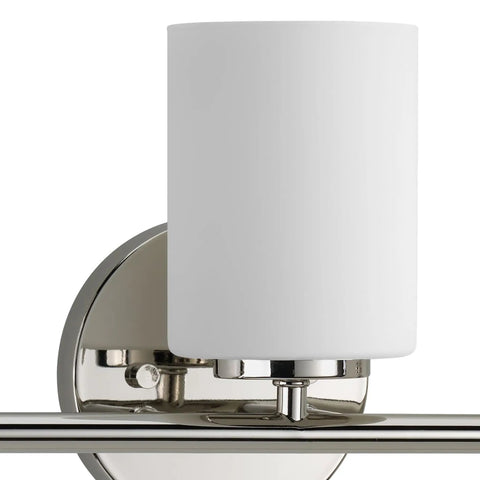 Close-up of a cylindrical etched glass shade on a polished nickel finish, part of the Three Light Etched Glass Modern Bath Vanity Light, Replay Collection.