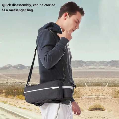 Waterproof Insulated Bike Rack Bag With 8 Liter Capacity For Bicycle Trunk Storage seen worn as a messenger bag.