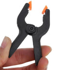 Close-up of a heavy duty nylon spring clamp set for DIY woodworking, 9 inch clamps for carpenter home workshop, versatile and durable tool kit