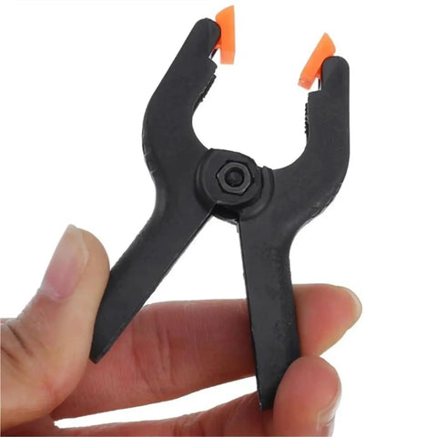 Close-up of a heavy duty nylon spring clamp set for DIY woodworking, 9 inch clamps for carpenter home workshop, versatile and durable tool kit