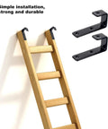 Heavy Duty Bunk Bed Ladder Hooks Keep Kids Beds Rock Solid Durable Black Steel Brackets Fit One Inch Rails Like A Charm For Loft Camper And RV Setup With Mounting Hardware Ready Two Pack on a wooden ladder.