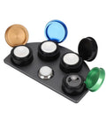 Stainless Steel Watch Oil Dip Tool With Lid Four Eye Oil Dish for precision lubrication, featuring open colorful lids on bench.