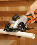 Compact Cordless Mini Circular Saw 20V Battery Powered With Blazing 3400 RPM Motor cutting PVC pipe with laser guide.