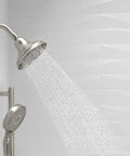 Bancroft 3 Function Showerhead with Katalyst Massage and Silk Sprays in Vibrant Brushed Nickel, water flowing in bathroom