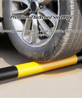 Built Like A Tank Full Weld Steel Driveway Guard And Warehouse Safety Barrier With U Shaped Floor Mount Design Using Thickened Reinforced Pipes That Handle Heavy Traffic Like A Boss Protect Your Garage Space Without Worries Ever, with tire on yellow and black thickened steel pipe.